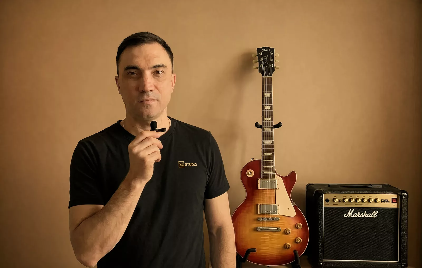 Serhii Lazariev with a Gibson Les Paul and a Marshall amp — live guitars for AI-generated tracks